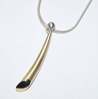 Wiggly pendant - 18ct yellow gold on silver chain.