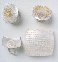 Group of rings and square brooch.