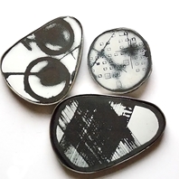 four Pin brooches