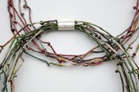 Twisted neckpieces detail