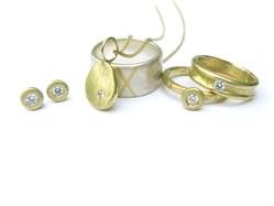 Silver and gold rings and earrings with diamonds by Sally Anne Lowe