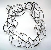 Gold and rubber neckpiece