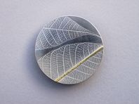Rubber leaf brooch