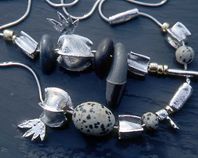 Two "Fiddler" necklaces.