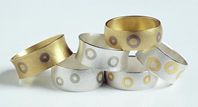 Rings in silver and 22ct gold or 18ct white gold and 18ct yellow with 18ct white gold.