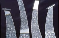 Oxidised silver vessels with gold details