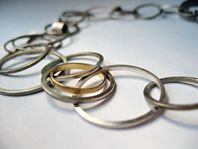 Silver, etch and 18ct gold multi hoop necklace.