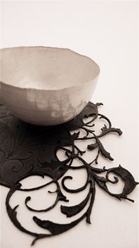 silver bowl on steel saucer