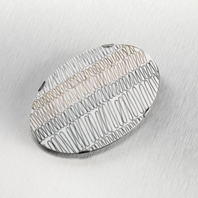 Silver, 9ct gold oval brooch